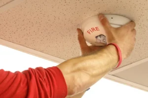Fire tech installing horn strobe